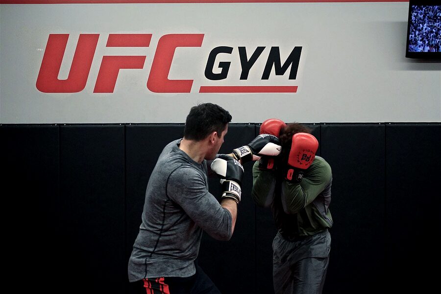 Two clients sparring on the gym floor