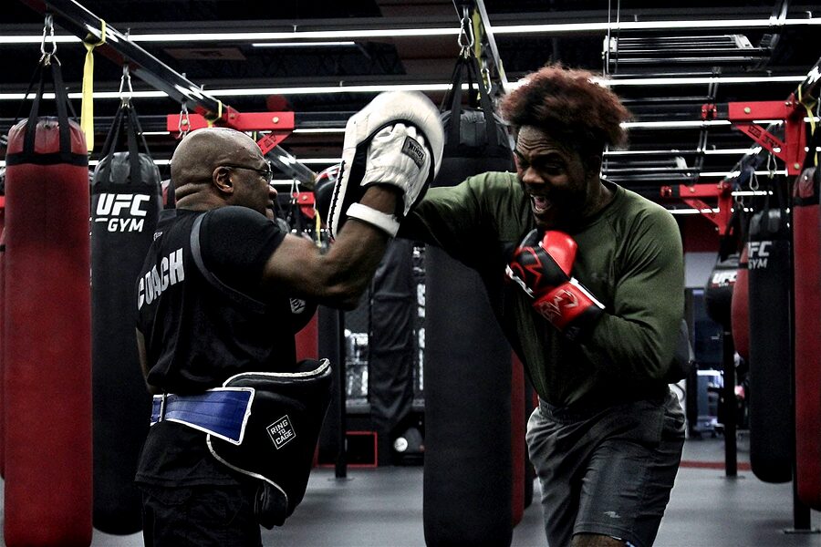 Yves catching a punch on the mitts